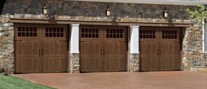 The Classica garage door in Walnut with Madiera windows.