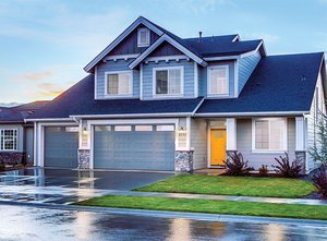 Our Olympus garage door in blue with in-panel windows.