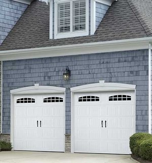 A Hillcrest house garage door in white with glass panels.
