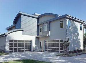 The Vista garage door in white with tinted glass windows.