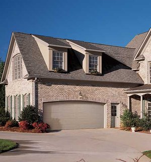 The Lincoln garage door with sandtone panels.